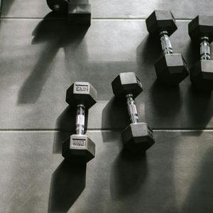 Close up of black metal dumbbells on the floor